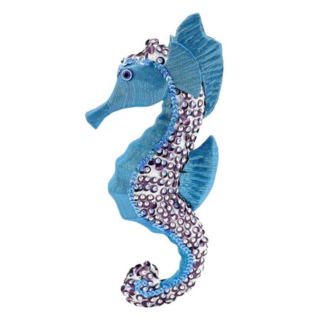 Seahorse ornament made of light blue fabric, blue sequins and white and purple sequins.