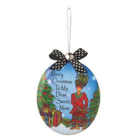 Oval hanging ornament with female character and text.