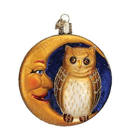 Round blown glass ornament of an owl sitting in a crescent moon.