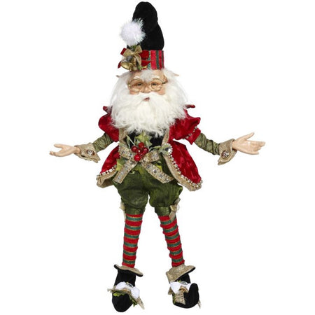 Elf figure wearing traditional red and green with berries and bow on belt.