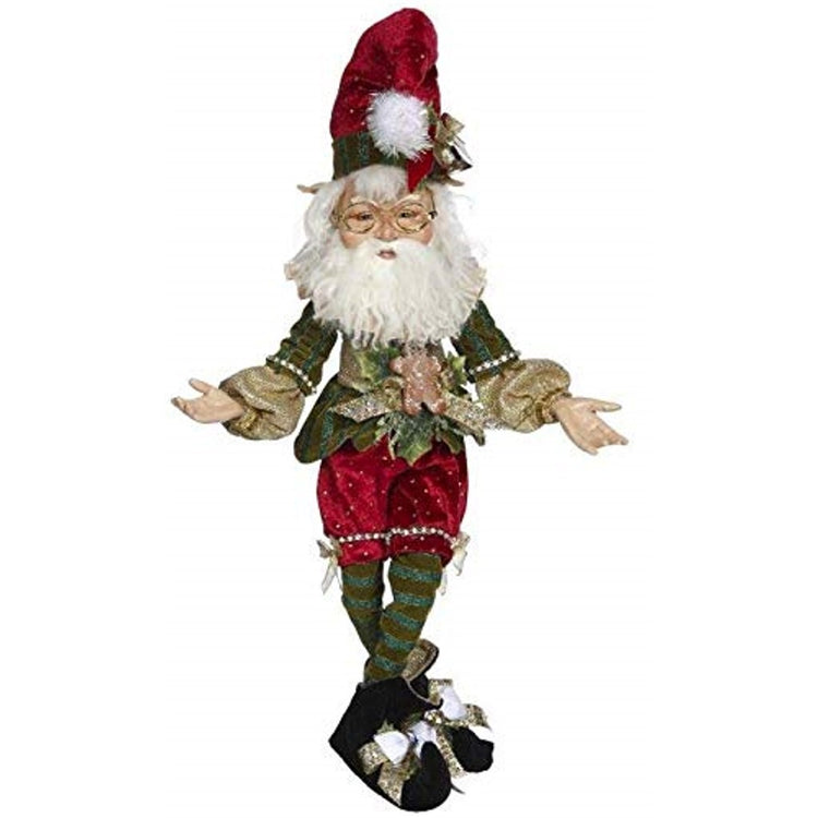 Elf figure wearing traditional Christmas red & green with Santa type pointy hat.