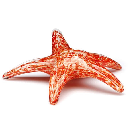 Orange & white swirled glass starfish, laying flat with one arm raised level.