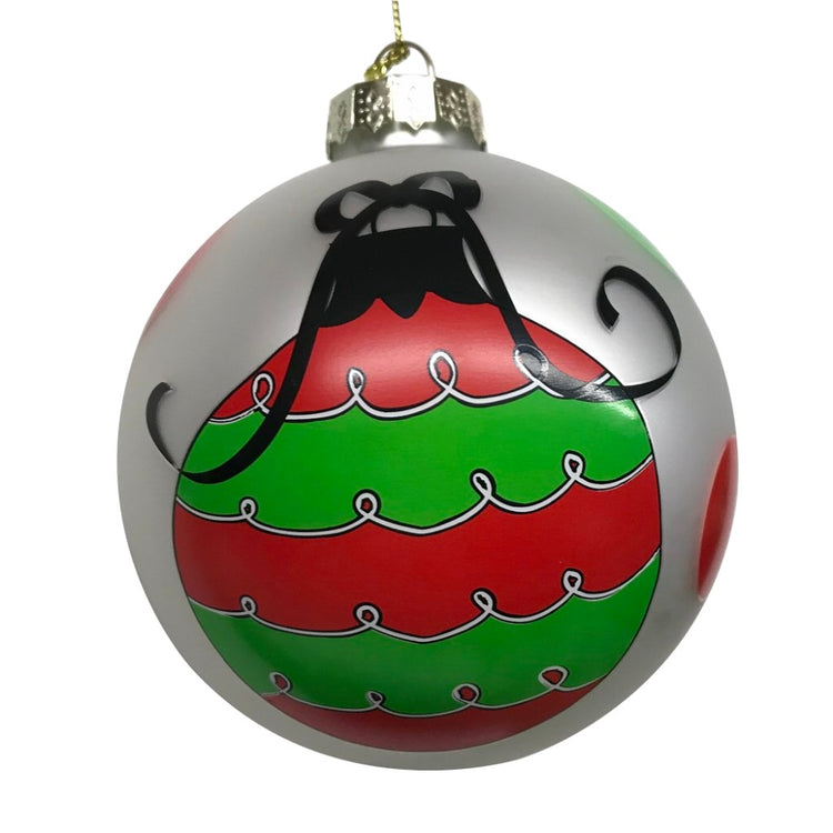 Iridescent round Christmas ornament with red and green ornament design on front.