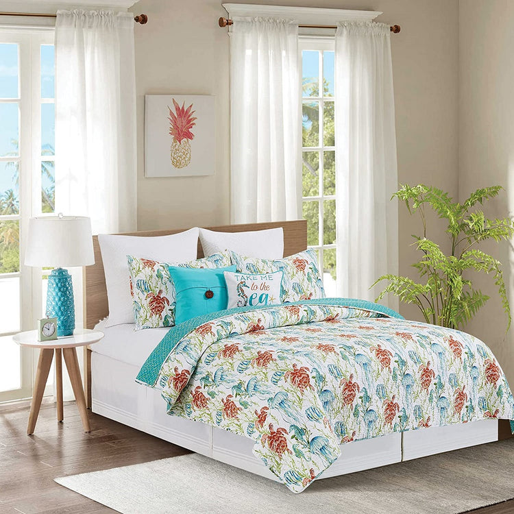 Photo shows a bedroom set but this listing is for the quilt and shams. Both have the same pattern of tan sea turtles and green jellyfish. Reverses to a solid aqua net pattern.