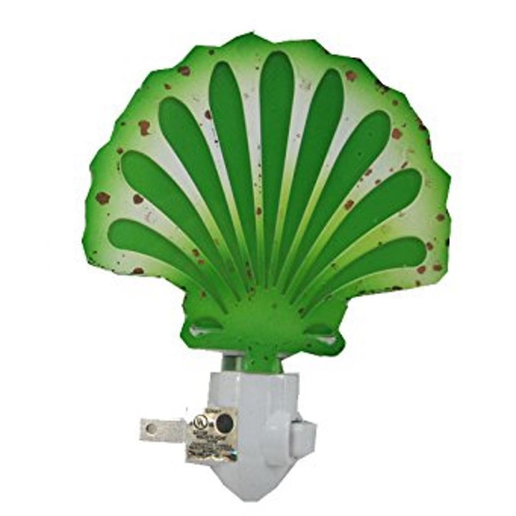 Green with brown spots shell shaped night light. 