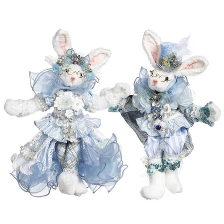 two furry rabbit figurines in blue fancy outfits