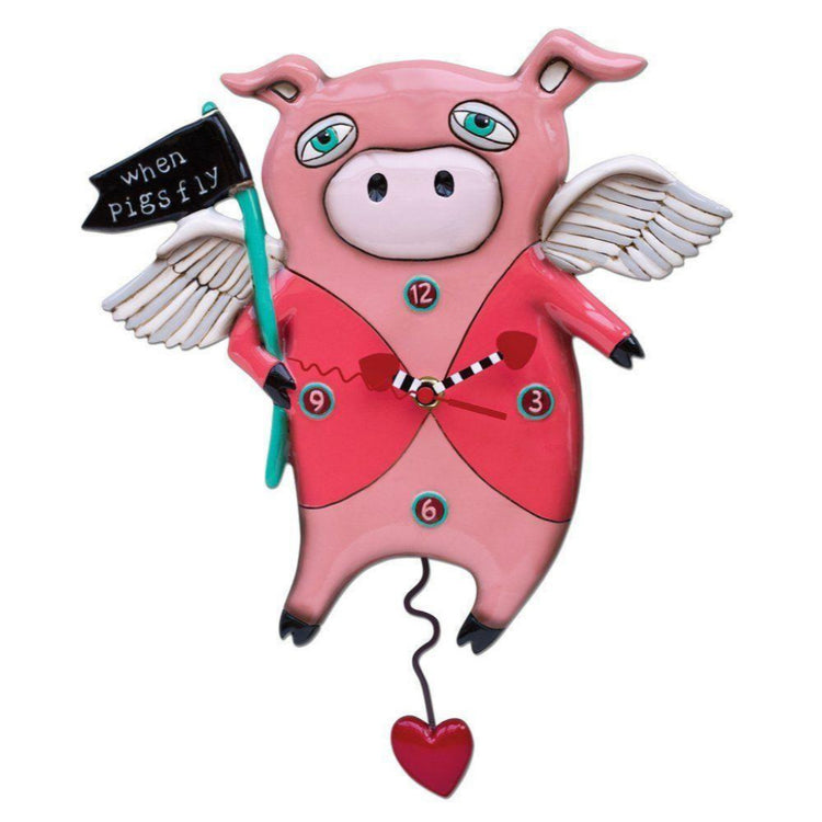 clock shaped like a pig wearing a pink jacked holding a flag that says "when pigs fly" heart pendulum