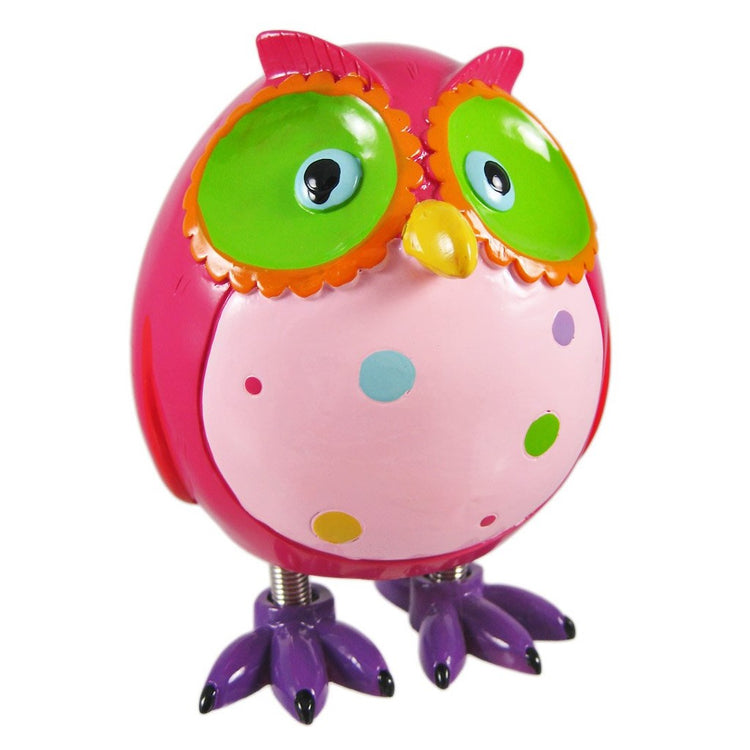 Owl shaped figurine coin bank with spring legs and bright colors of pink, green and orange.