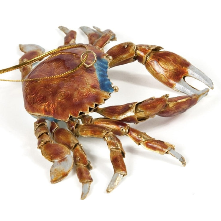 Blue crab shaped hanging Christmas ornament on gold cord.