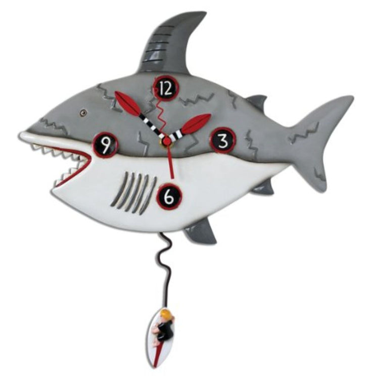 Shark designed hanging wall clock with surfer on surfboard pendulum.