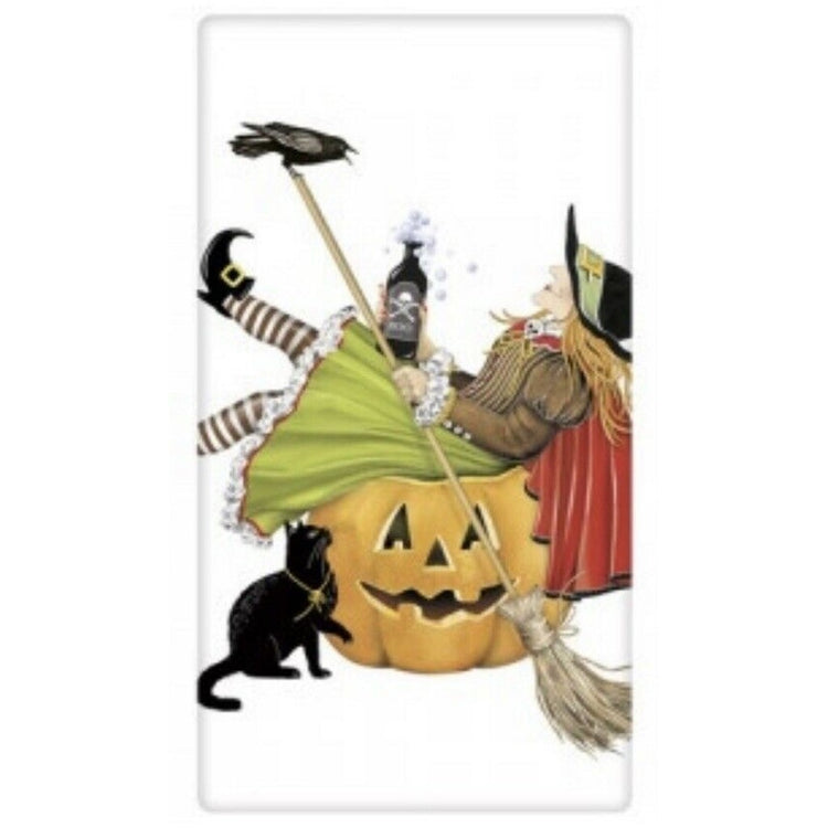 White towel with a witch sitting in a jack o lantern holding a broom.