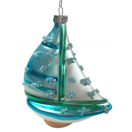 Blue and green shaped sailboat with bead accent.