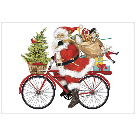 White towel. Santa riding a bike with gifts on the back, a bag of presents over his shoulder and a tree in the front basket.