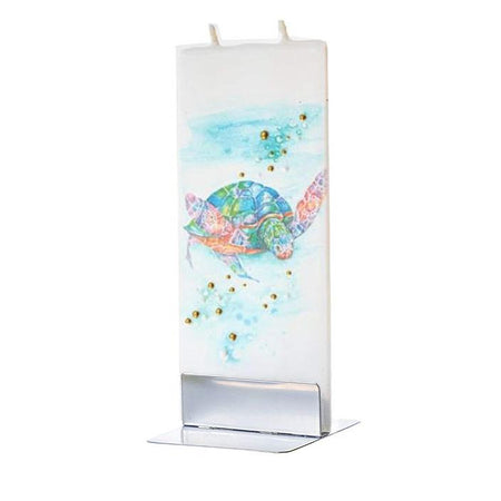 white flat candle with blue & green sea turtle swimming