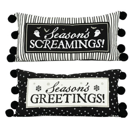 Reversible black and white pillow with pom pom accents, one side is halloween "season's screamings" and the other says "season's greetings"
