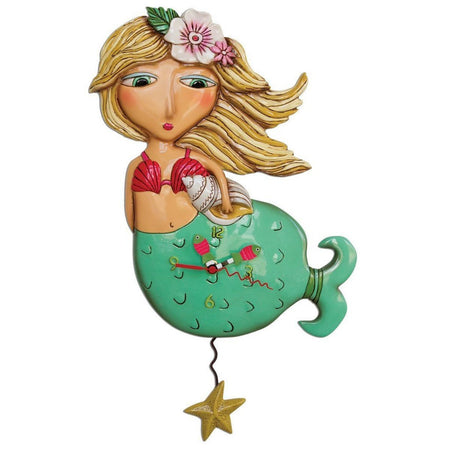 Mermaid design clock. Mermaid is blonde with a pink shell bra, a conch shell in hand & a green tail. Pendulum is a starfish.