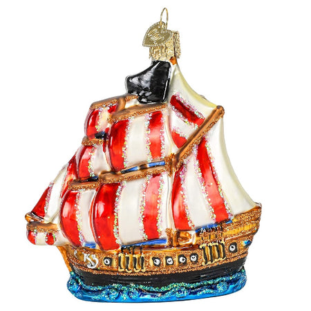 Blown glass pirate ship ornament with red and white striped sails