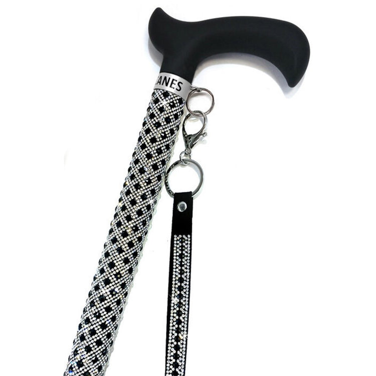 Beaded cane with attached wristlet.  Black beads and silver.