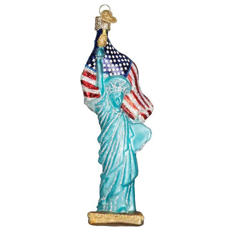 Blown glass statue of liberty with American flag ornament, silver, white and gold glitter accents.