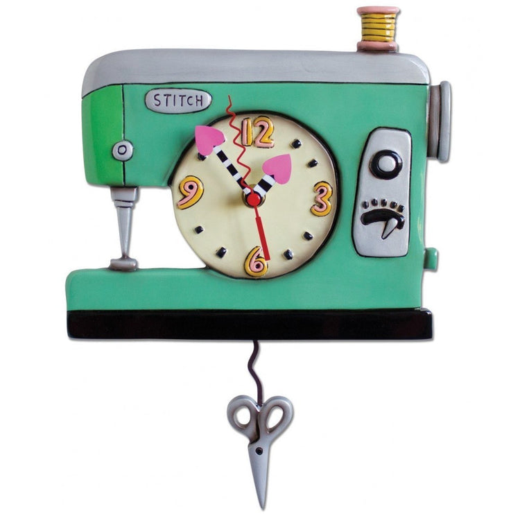 Green sewing machine design wall clock with scissor  pendulum.