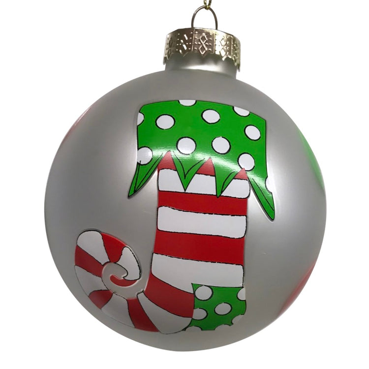 Iridescent round Christmas ornament with red and white striped stocking with green accents.
