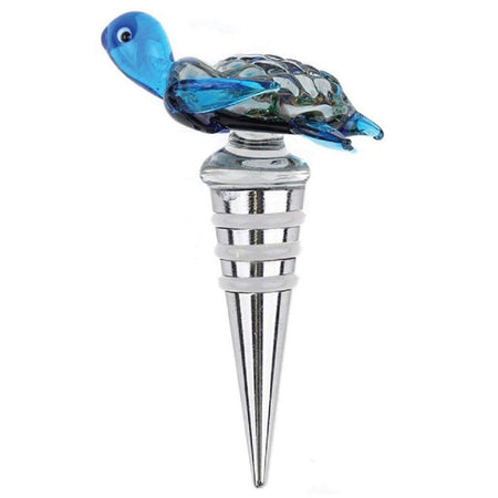 glass blue sea turtle in swimming pose attached to the top of silver wine bottle stopper.