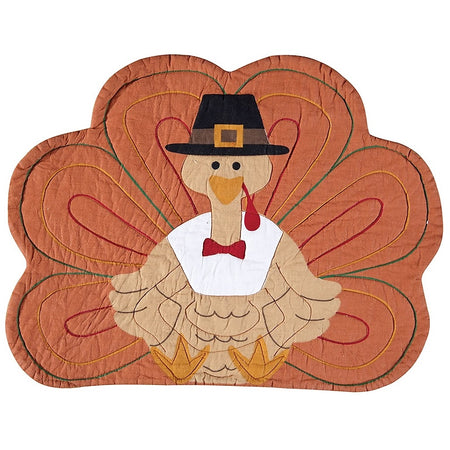 Fabric placemat shaped like a turkey, wearing a Pilgrim hat.