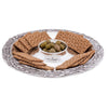 Silver etched pattern round platter with crackers and bowl of olives in middle.