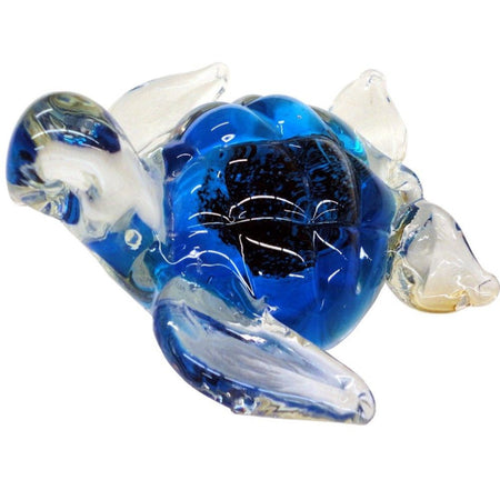 Clear glass sea turtle with royal blue insides.