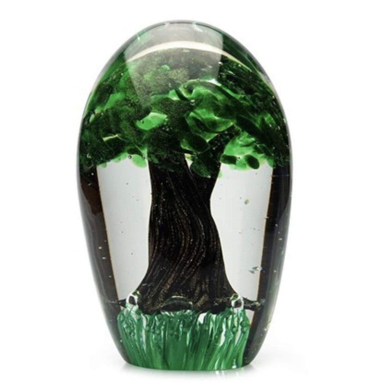 Clear glass paperweight with tree decor encased within.