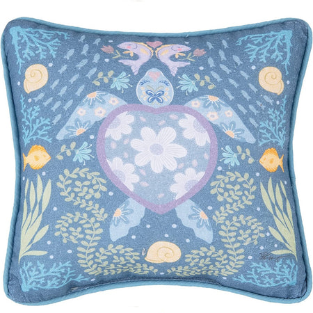 Square blue pillow with a center large turtle shown frm above with floral shell and fins. 2 fish back to back on top and file coral and shell accents on pillow.  Artistic design.