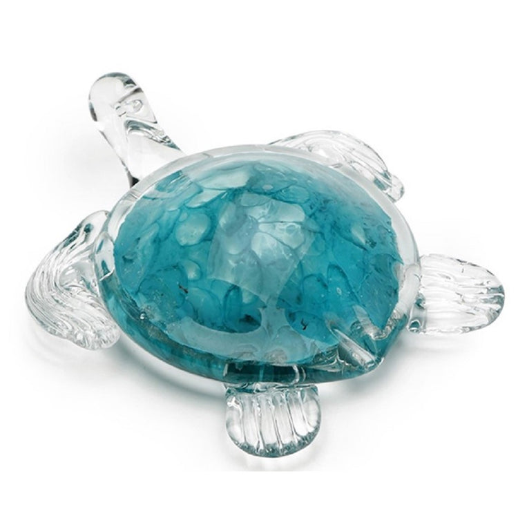 Clear sea turtle figurine with teal under on shell.