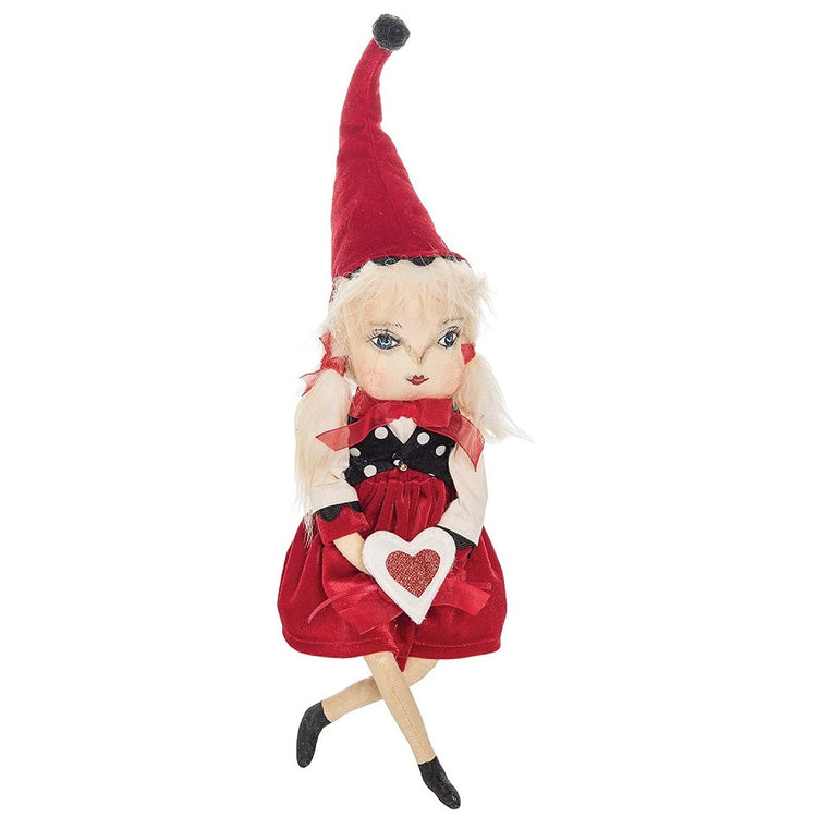 valerie is a fabric doll figurine with blonde pigtails, a red dress and matching stocking cap, and she's holding a sparkly red and white heart.